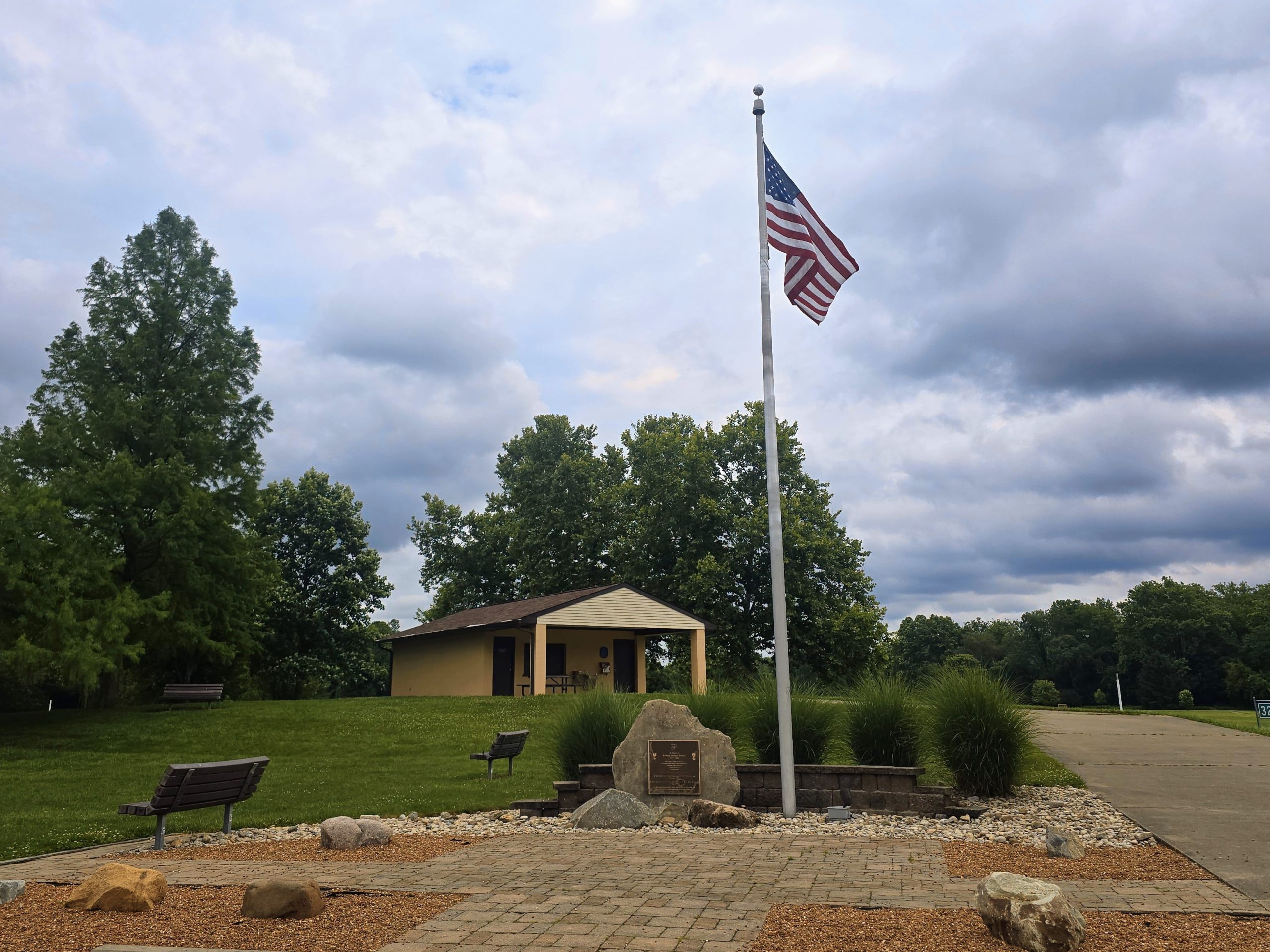 Camp Dennison Memorial Park flag and restroom facilities.