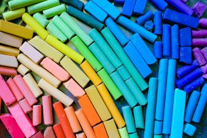 pieces of colorful chalk laying together
