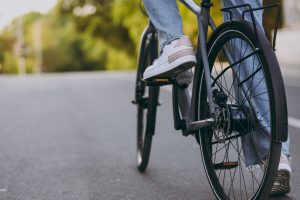 view of bottom of bicycle traveling down a road
