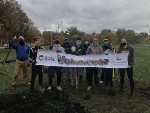 Volunteers assisting in a tree planting