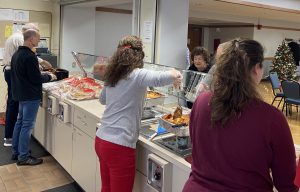 Volunteers Serve Food