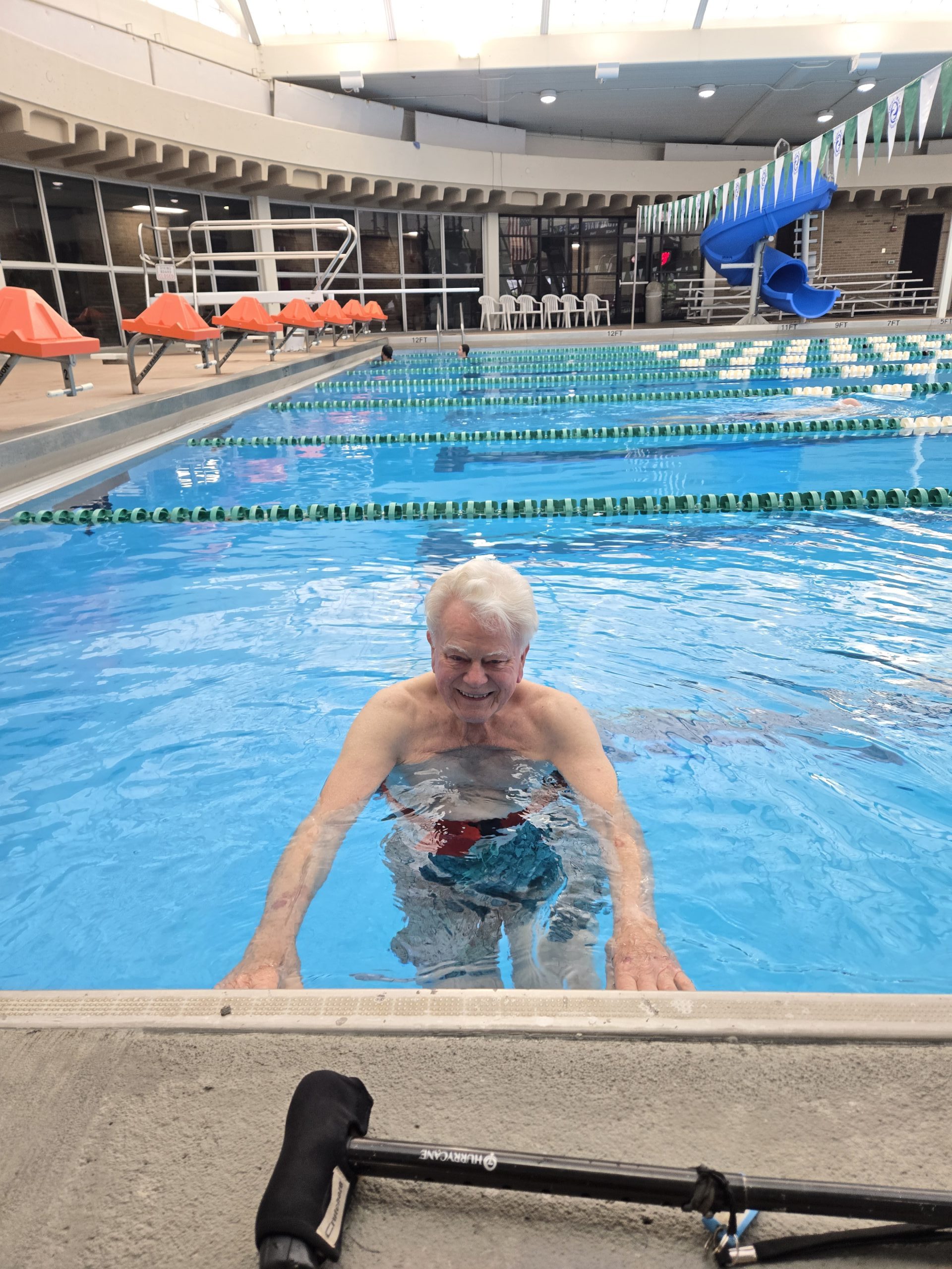 Tom McManus swimming in pool