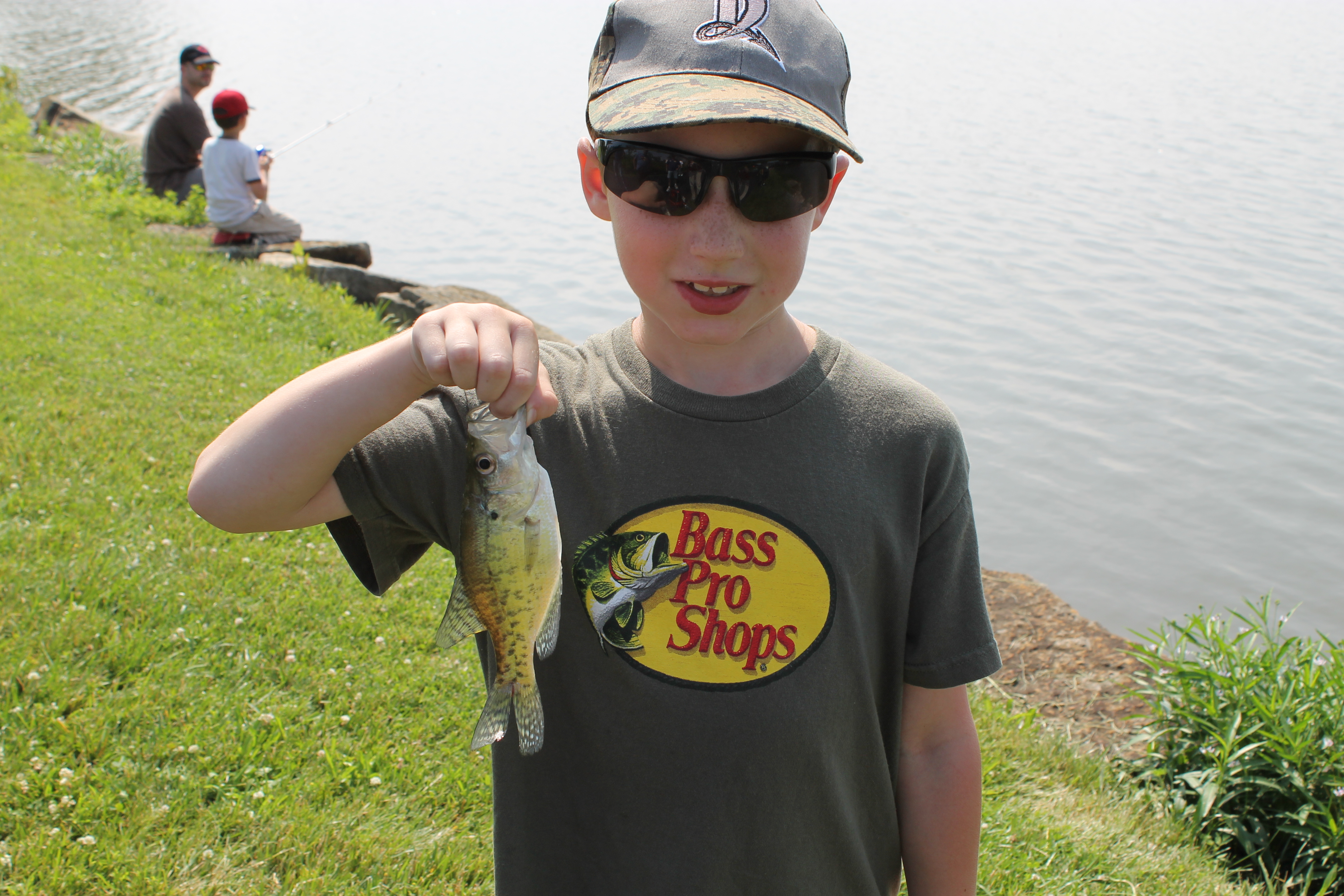 Young angler a natural at teaching other kids how to fish