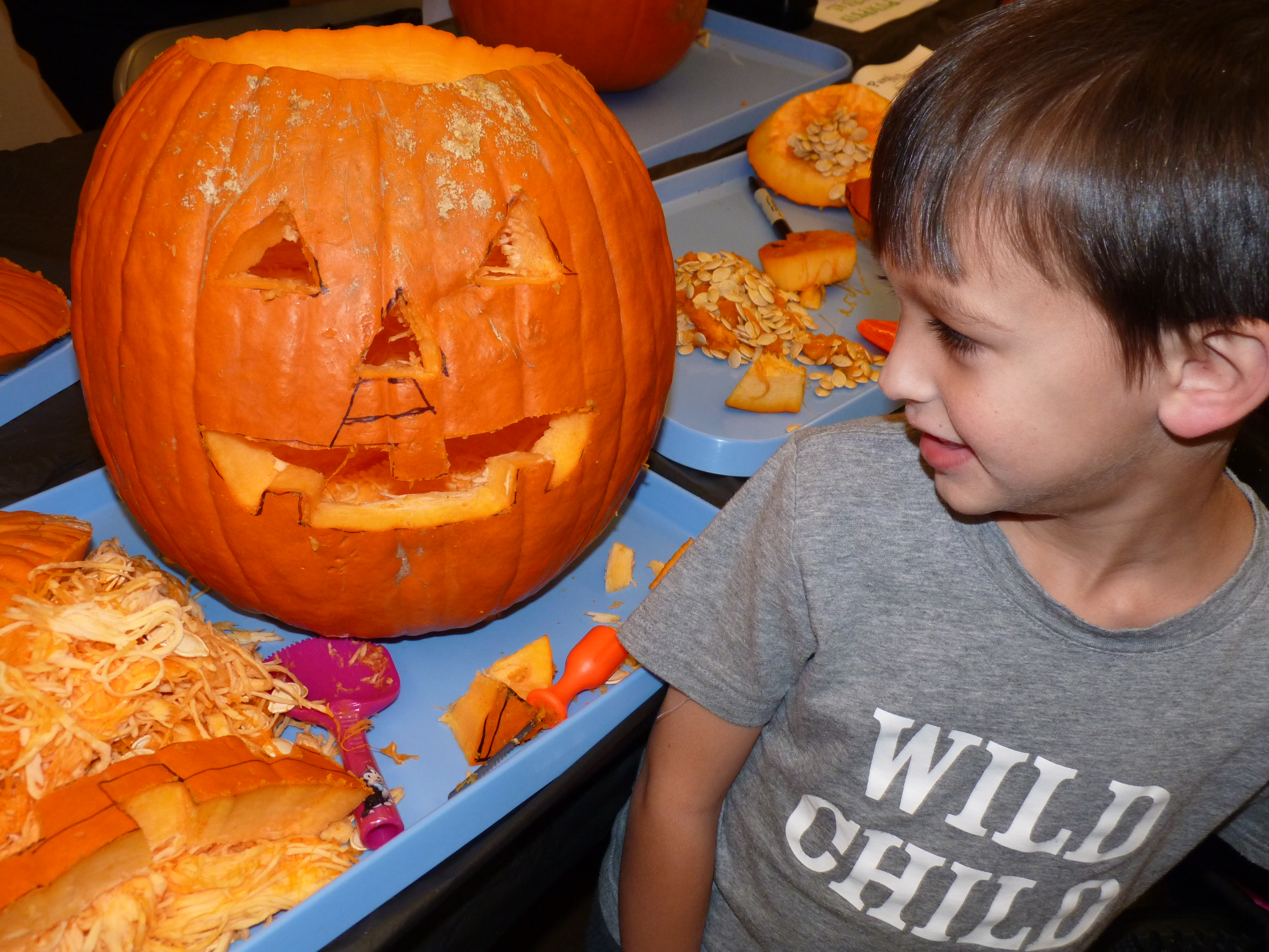 kid with pumpkin