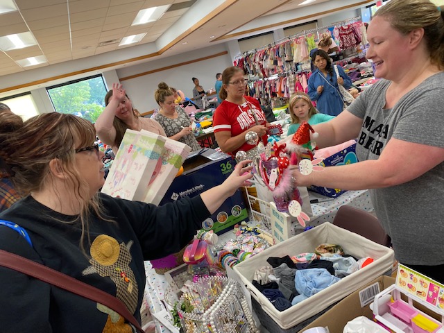 woman selling kids items