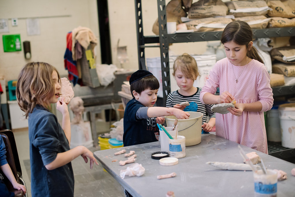 kids making pottery