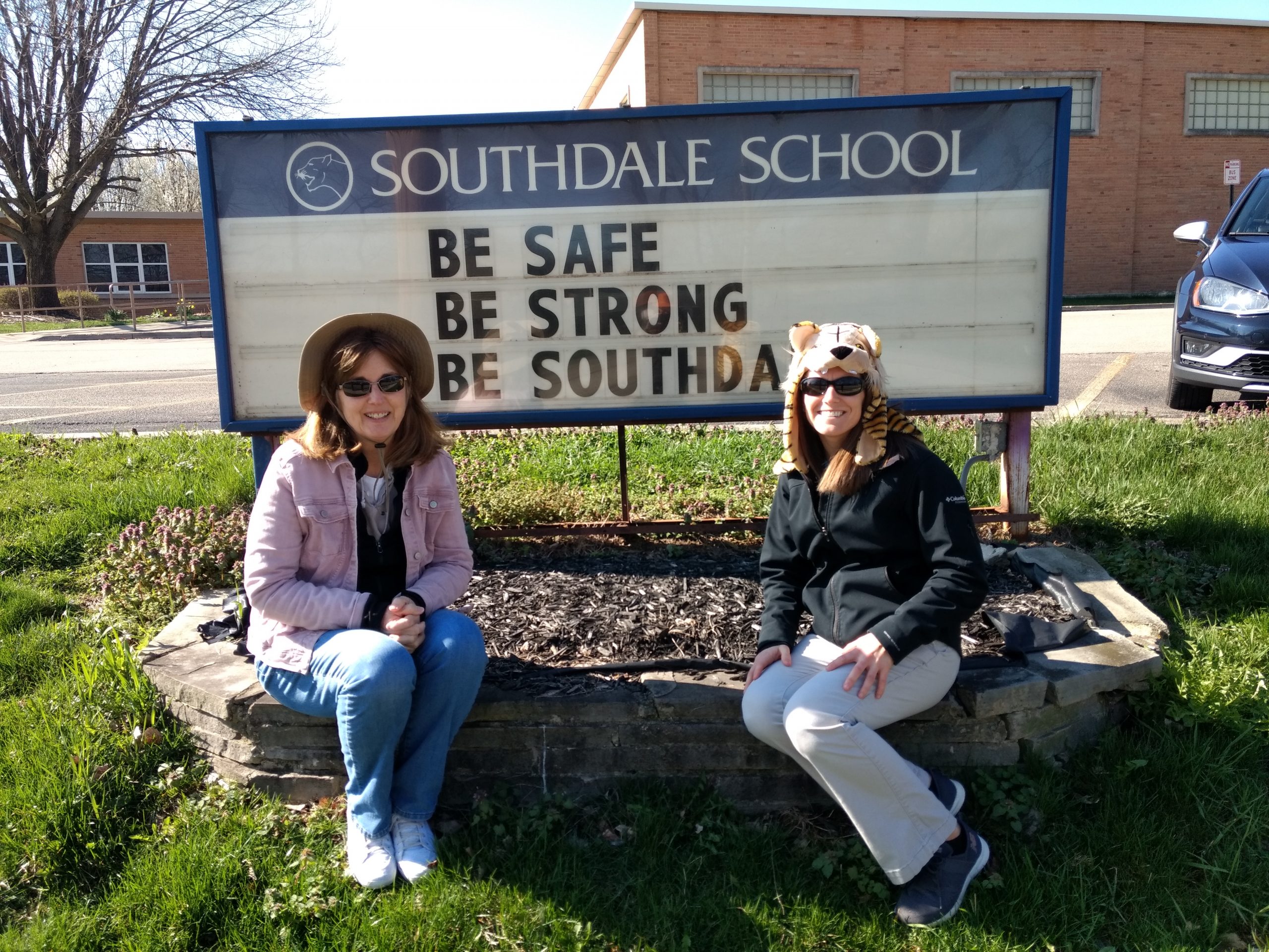 staff with school sign