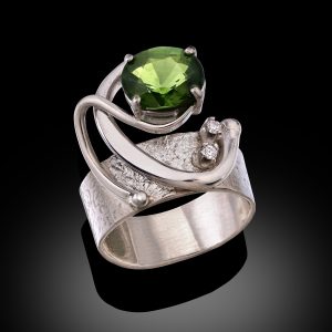 green and silver ring