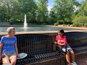 grandmother and granddaughter on bench