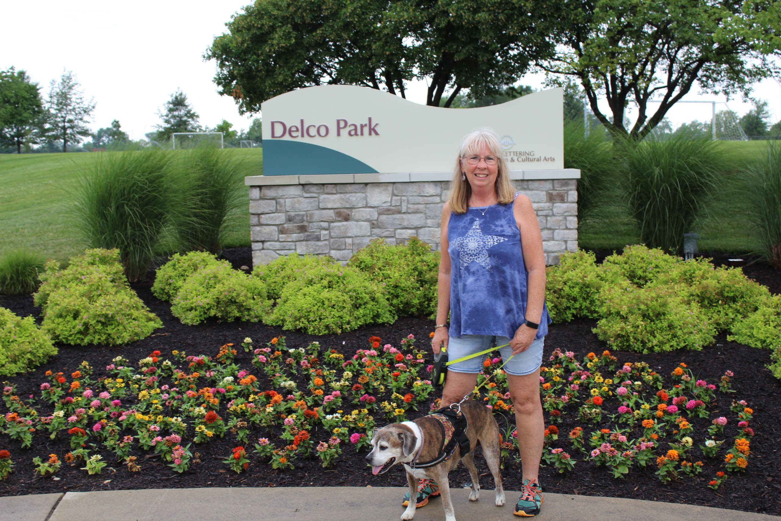 woman and dog in park