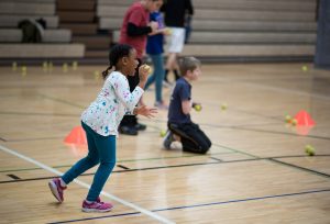 girl throwing ball