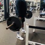 man lifting weights