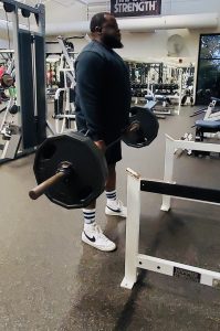 man lifting weights