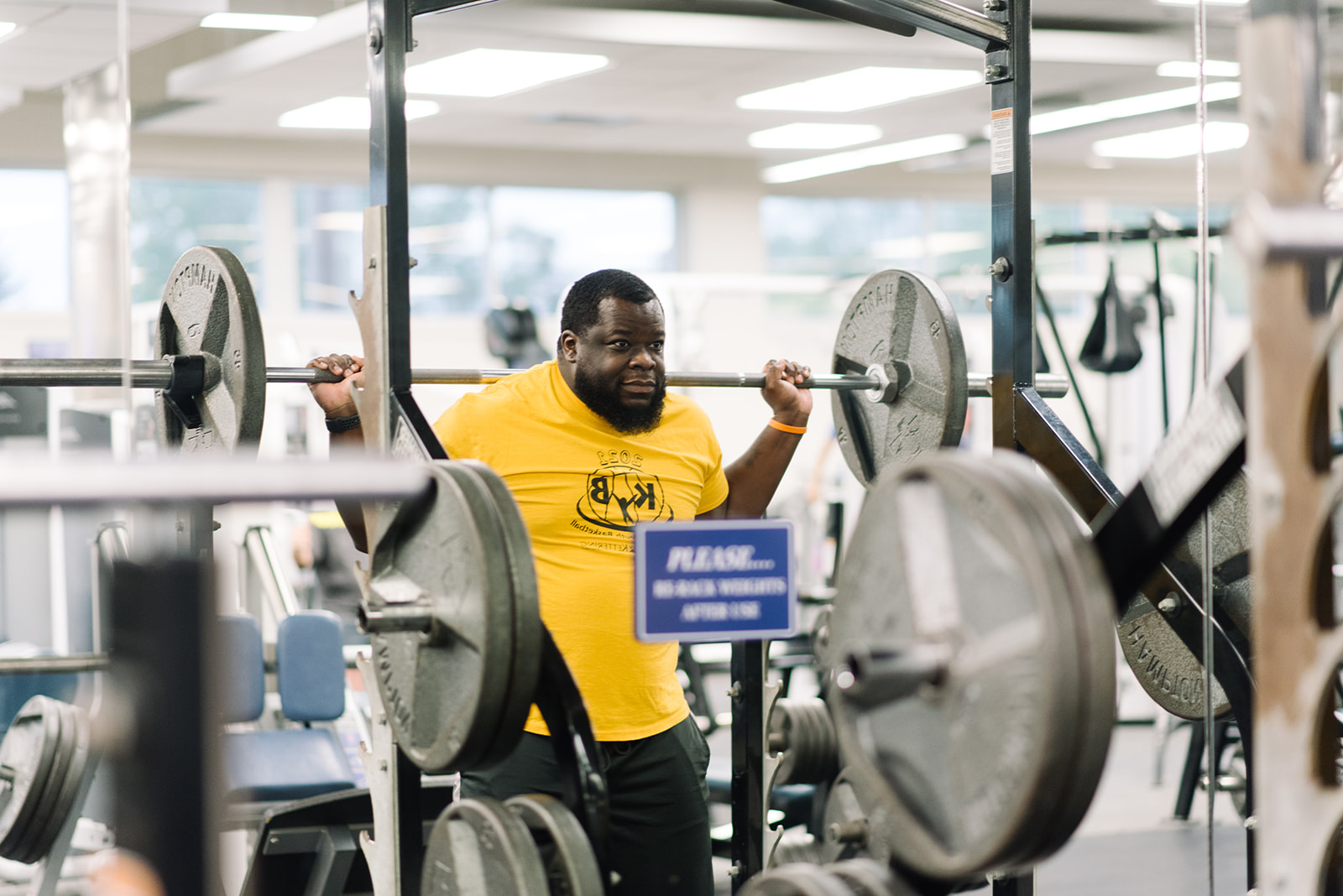 man lifting weights