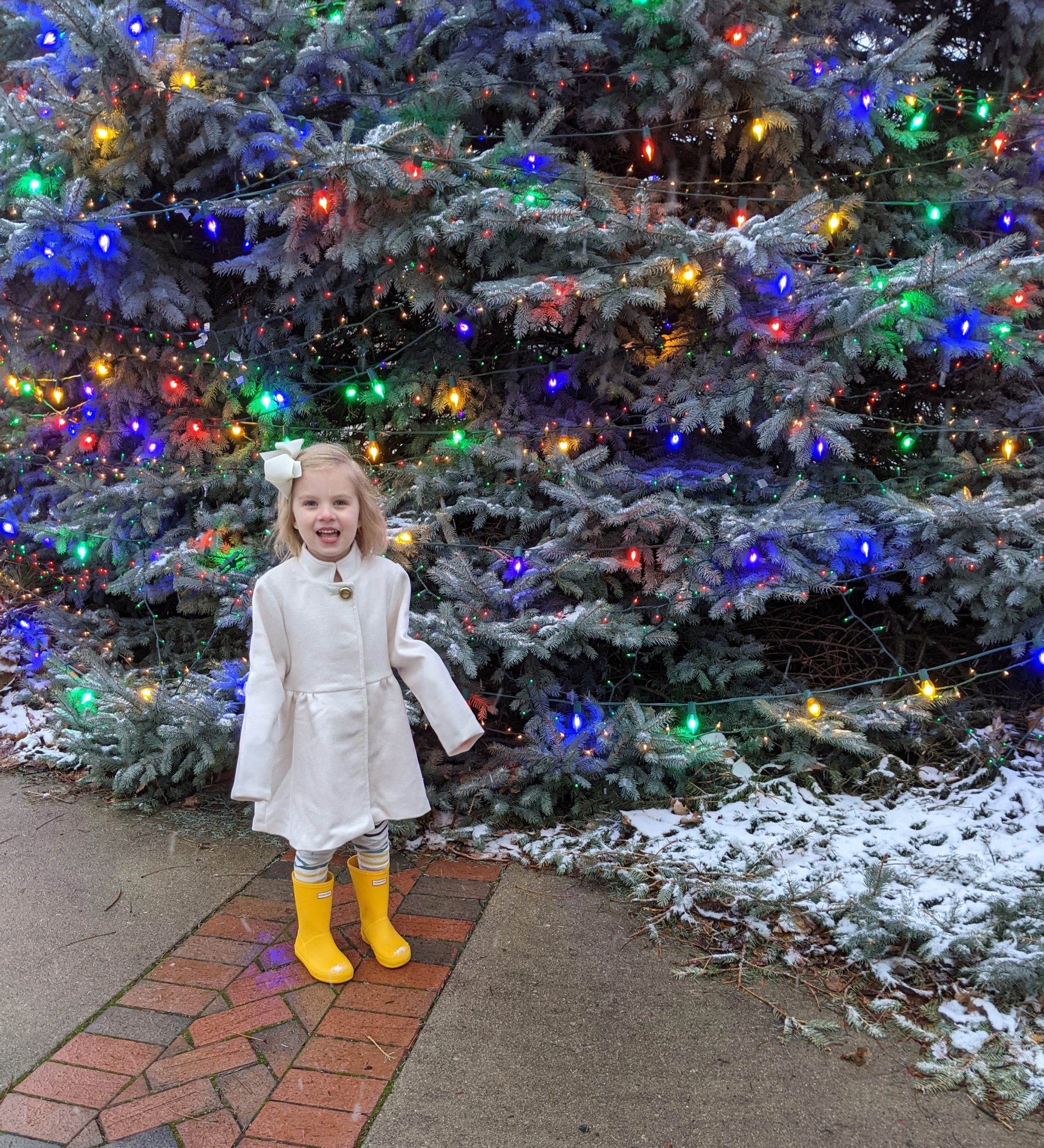 child with christmas tree