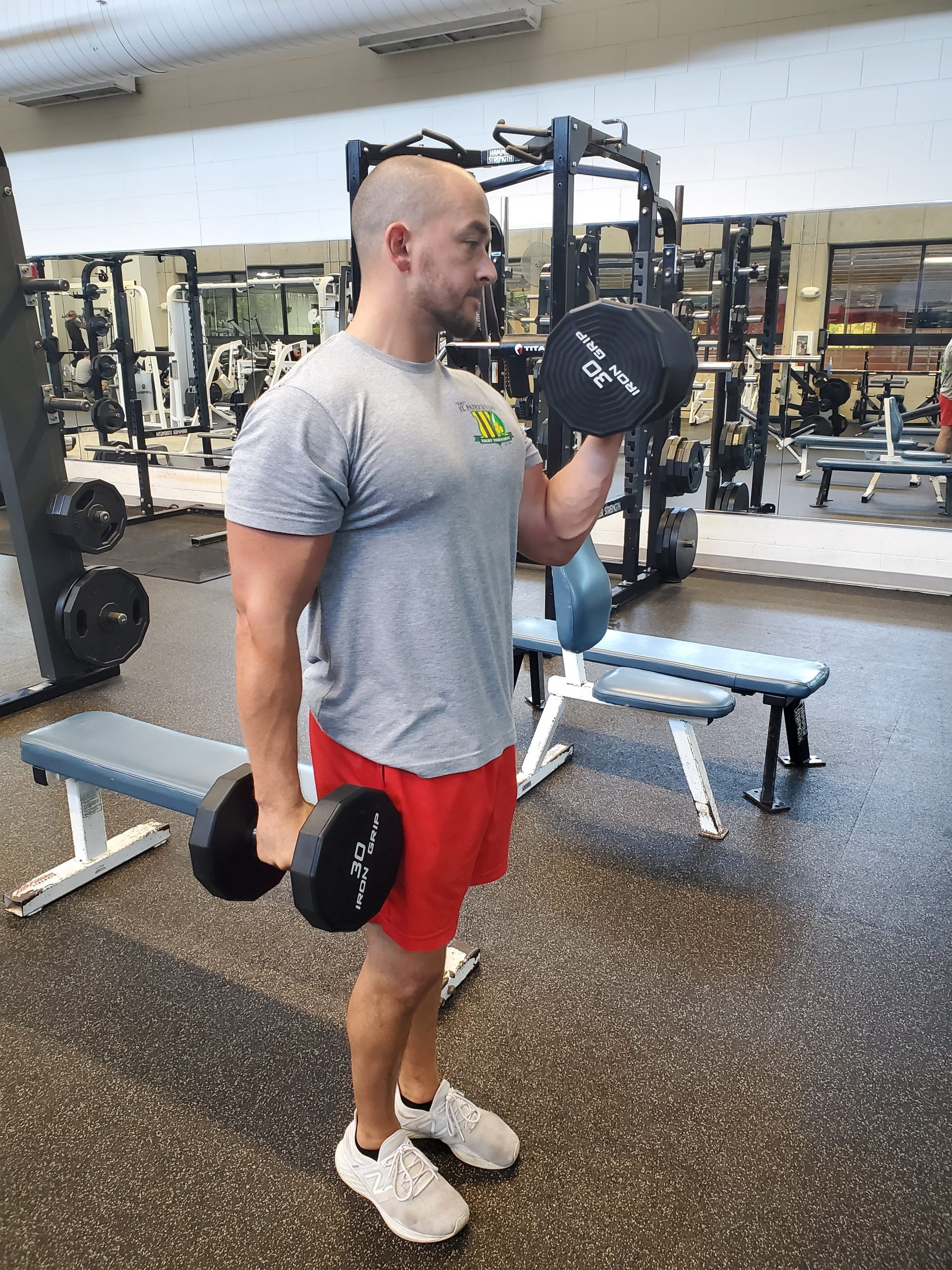 man lifting weights