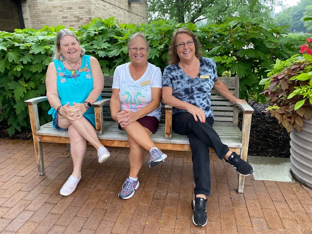 three women on bench