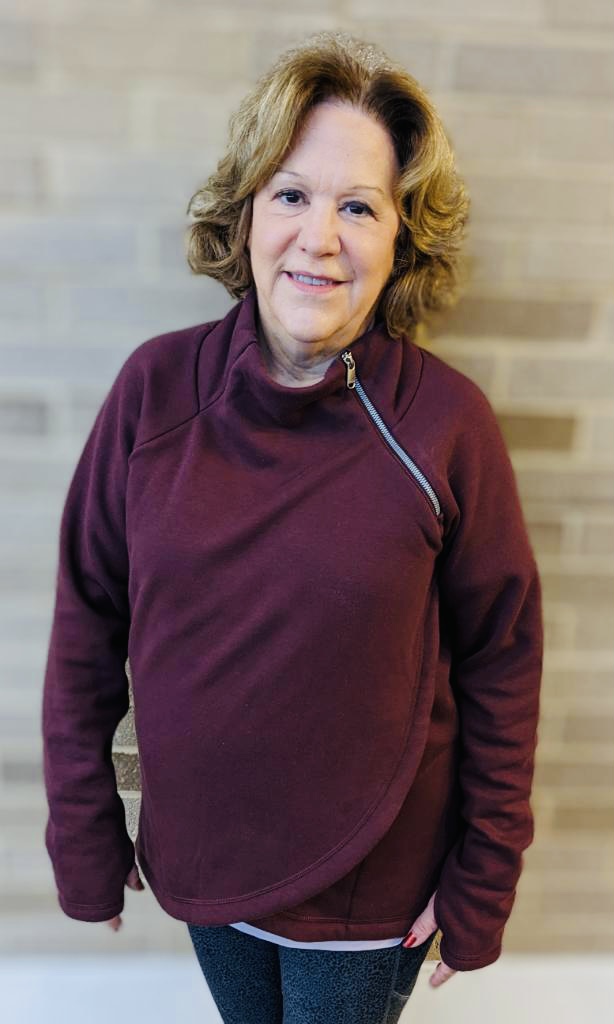 woman in maroon shirt