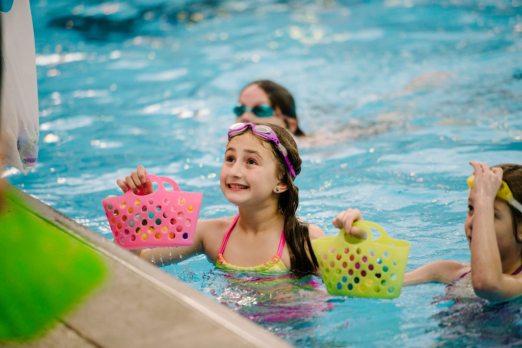 girl swimming with eggs