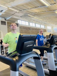 man and woman exercising