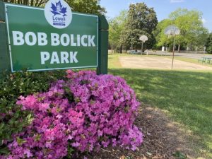 Bob Bolick Park sign and flowers