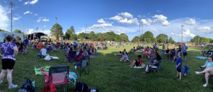 Community Event People Sitting on Lawn