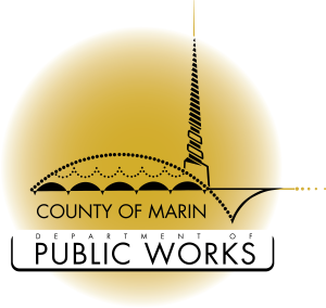 Marin County Public Works logo, a yellow circle with a black line design of a building.