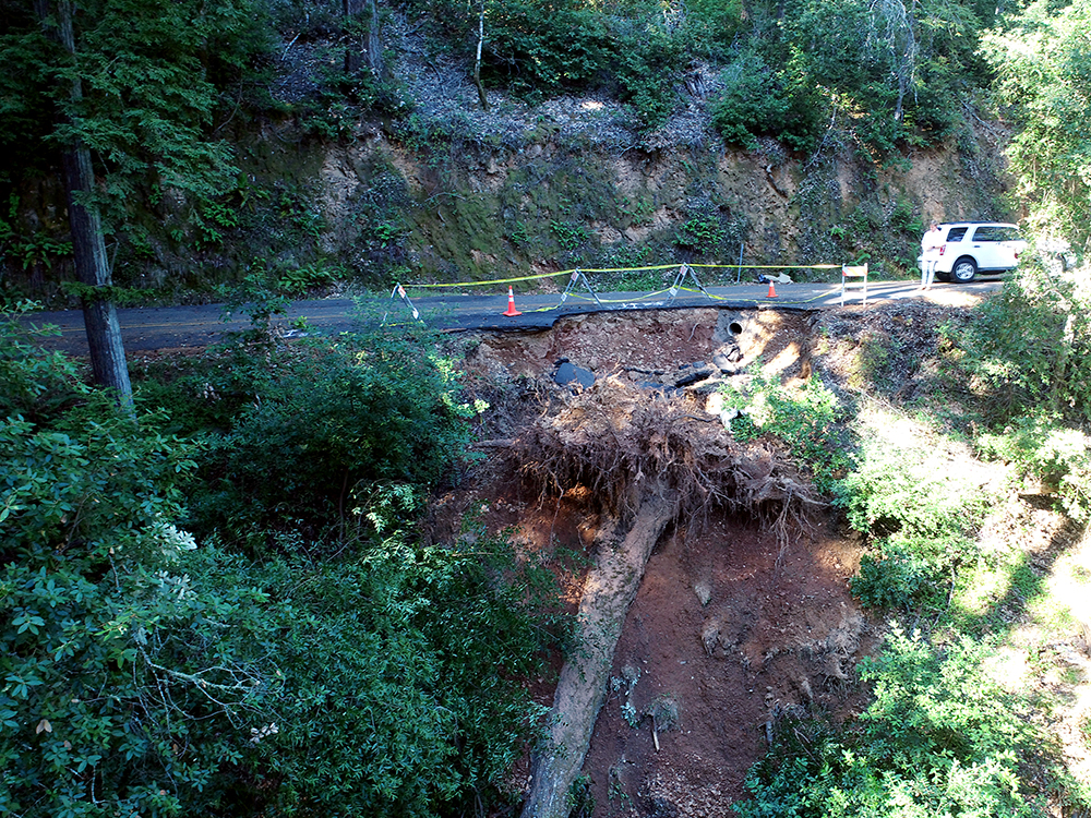 Damaged section of Fairfax Bolinas Road due to a large tree that fell during the major storm on October 24 2021.