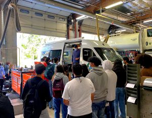 Group of high school students touring the public works facility