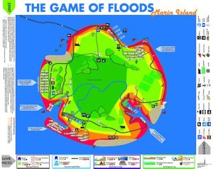 Game of Floods game board has a green island with different colors and icons marking land uses on the island