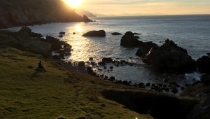 Sunset view from Steep Ravine campground, with rocky coastline extending southward