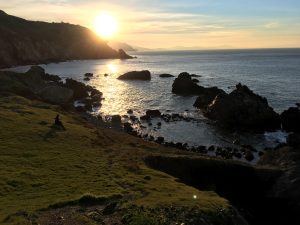Sunset view from Steep Ravine campground, with rocky coastline extending southward