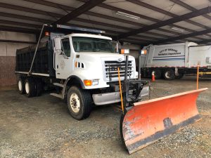 Dump truck with plow