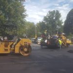 Workers resurfacing a street