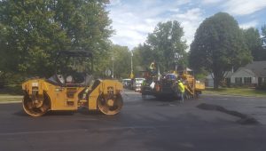 Workers resurfacing a street