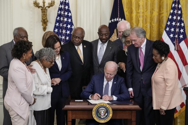 President Joe Biden signs the Juneteenth National Independence Day Act into law on June 17th, 2021. Photo Credit: Drew Angerer/Getty Images