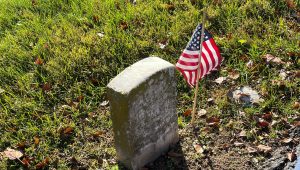 tombstone deocrated with an American flag