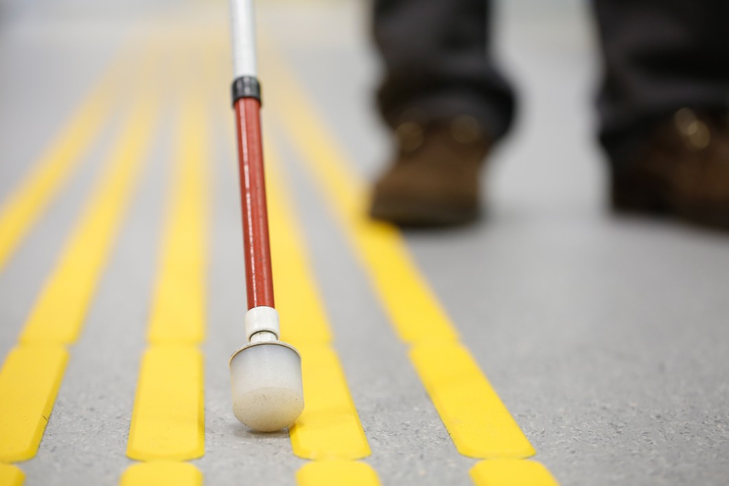 walking cane on a street with yellow markings