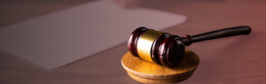 A gavel rests on a desk