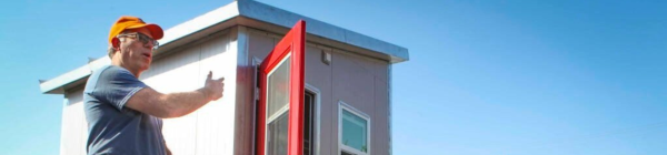 man showing off the new housing in the Petaluma People's Village