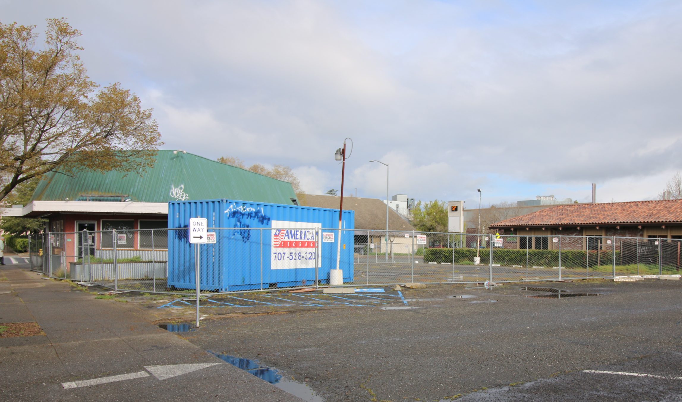IMG_8747 a vacant parking lot beside an empty restaurant building