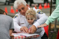 police volunteer with girl