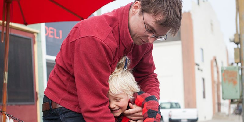 photo of man with red sweater