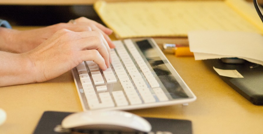 photo of hands on keyboard