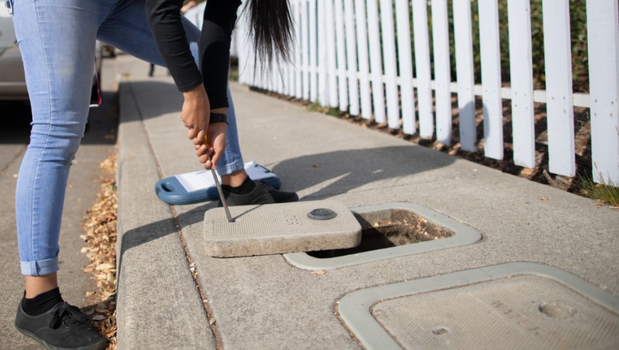 photo of person reading water meter