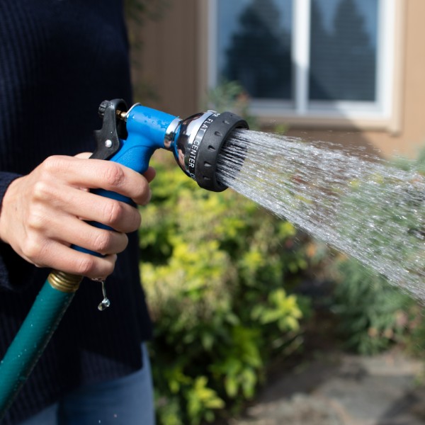 photo of woman spraying water