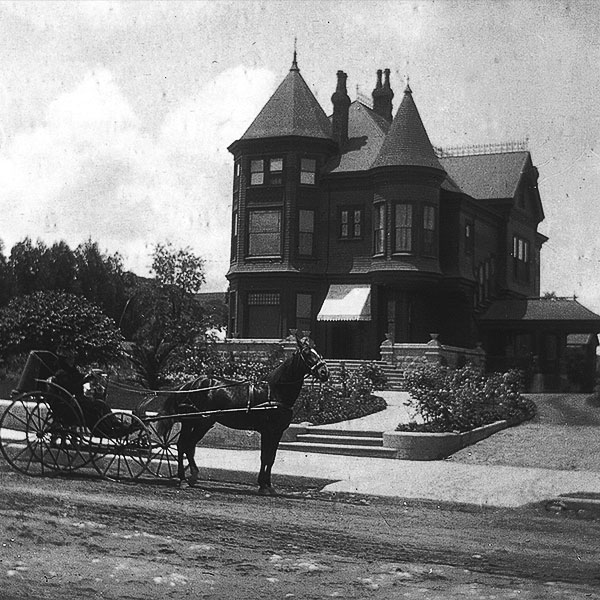 brown house with carriage