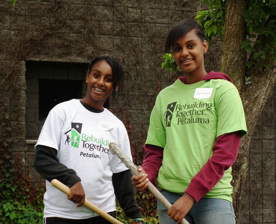 girls with rebuilding together tee shirts