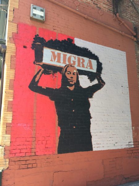 mural of person holding basket of grapes