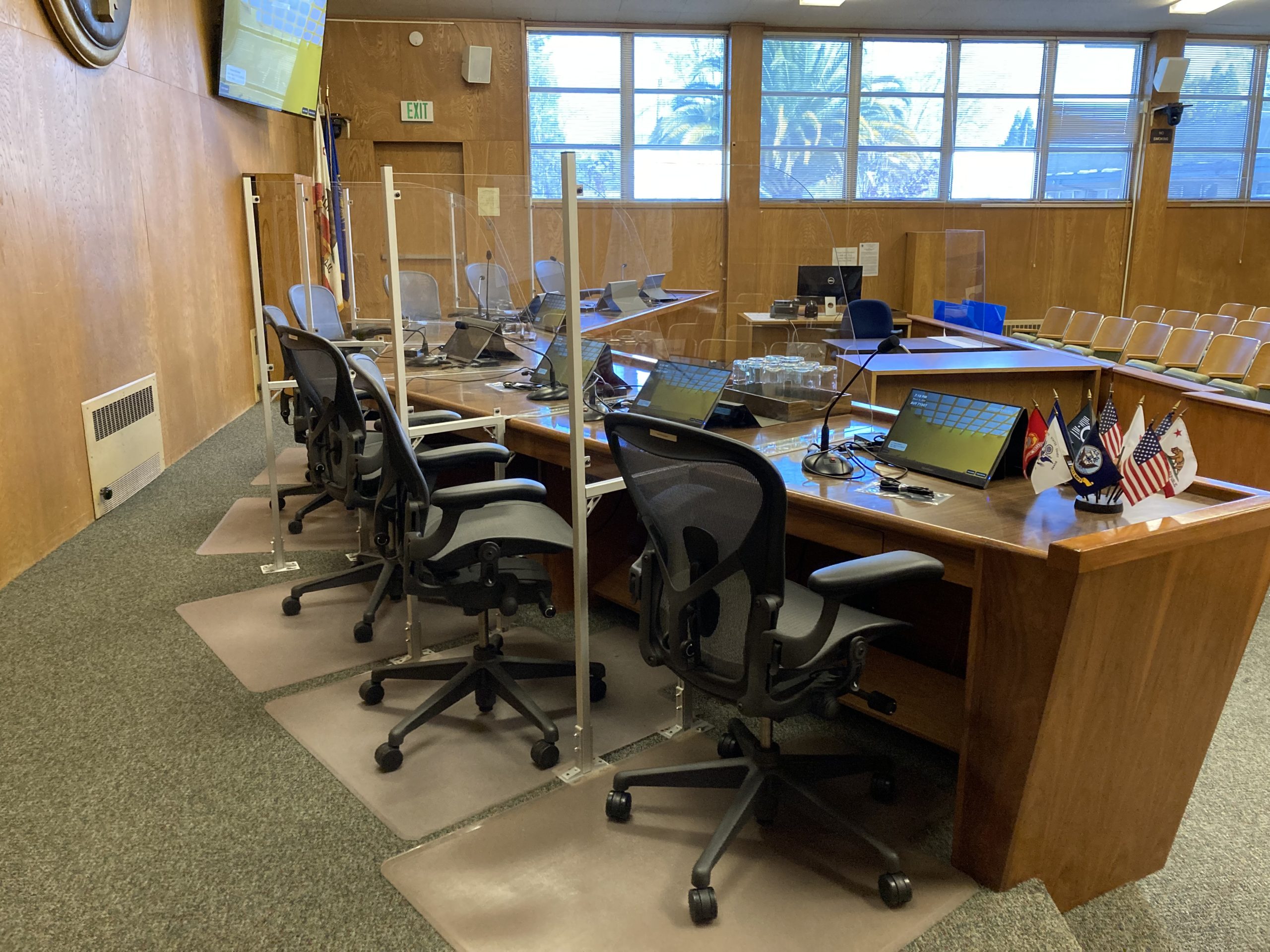 Image of seats where city council members sit during city hall meetings in council chambers